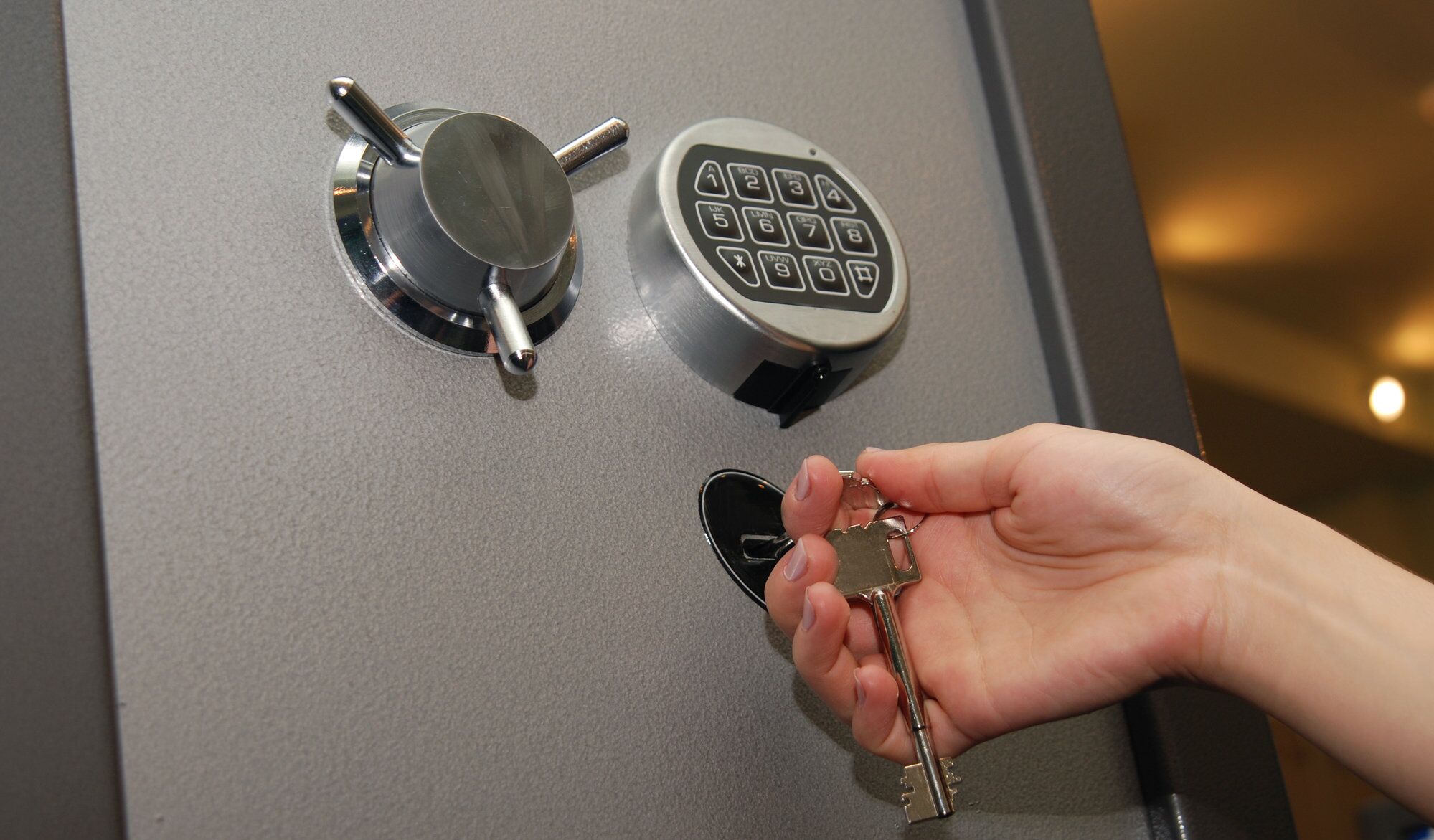Safe technician working on combination lock