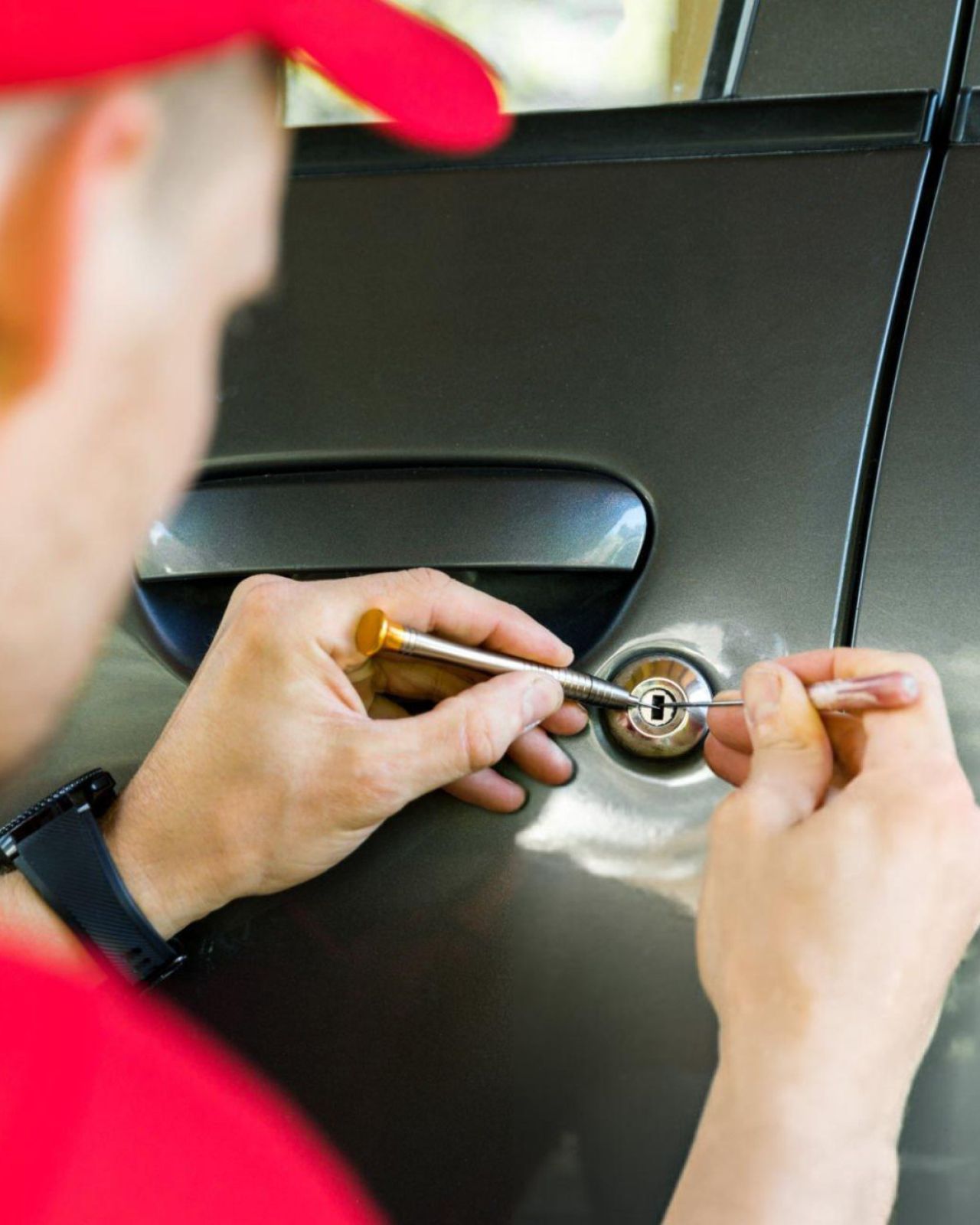 Automotive locksmith unlocking vehicle